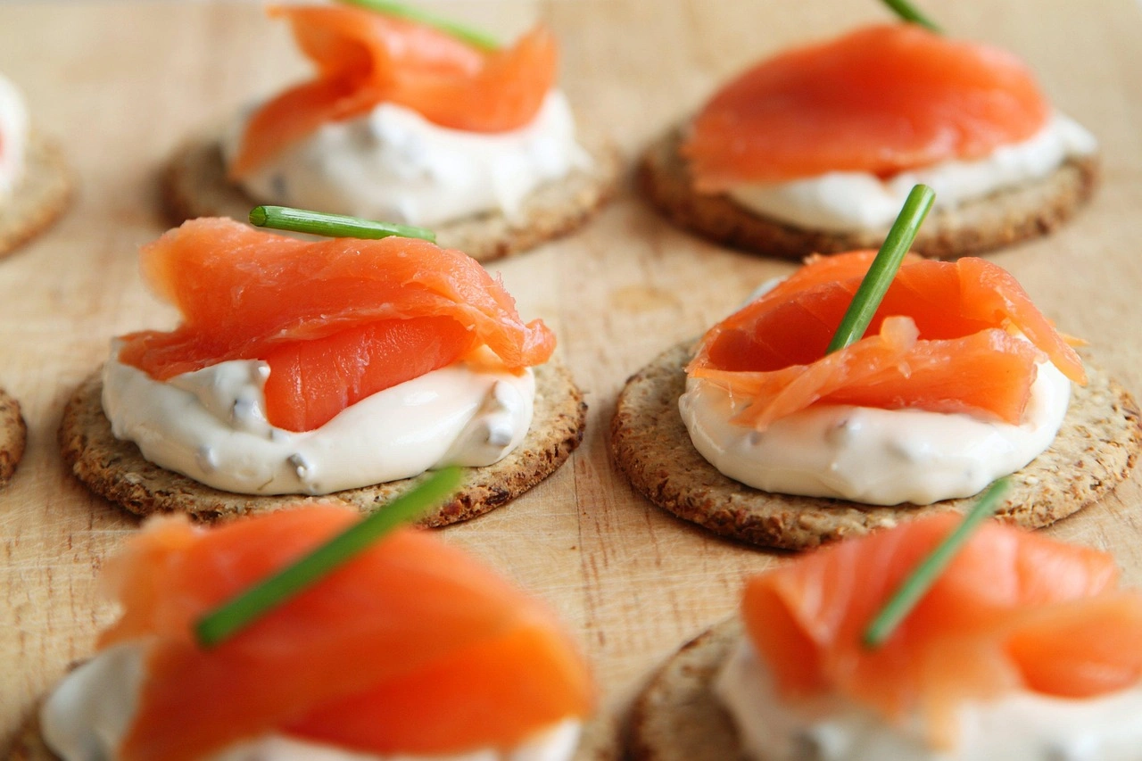 Smoked salmon canapés on oat crackers