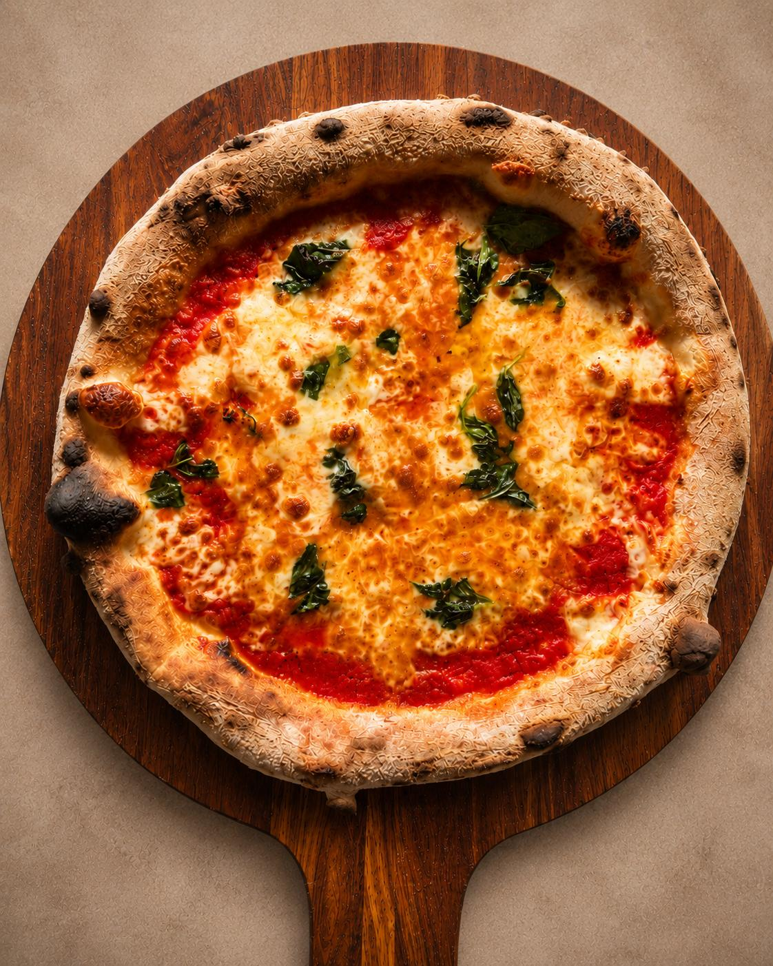 Woodfired Margherita pizza on a wooden board — Bello Classics